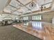 Large event space with hardwood dance floor, carpeted area, and ample windows at 603 Canyon Overlook, Canton, GA 30114