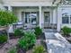 Inviting front porch with chairs, plants, and stylish decor creating a welcoming entrance at 603 Canyon Overlook, Canton, GA 30114