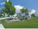 Beautifully landscaped front yard with vibrant greenery, stone border, and white siding house at 603 Canyon Overlook, Canton, GA 30114