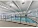Bright indoor pool area with high ceilings, ample lighting, and nearby lounge area at 603 Canyon Overlook, Canton, GA 30114
