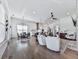 Open concept living area with fireplace, hardwood floors, kitchen, and dining area at 603 Canyon Overlook, Canton, GA 30114