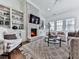 Comfortable living room showcasing a brick fireplace, built-in shelving, and plush seating at 603 Canyon Overlook, Canton, GA 30114