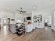 Open-concept living room with built-in shelving, fireplace, and hardwood flooring at 603 Canyon Overlook, Canton, GA 30114