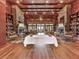 Clubhouse lounge with wood floors, coffered ceiling, stone columns, and bookshelves at 603 Canyon Overlook, Canton, GA 30114