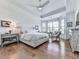 Bright main bedroom with a tray ceiling, large windows, and hardwood floors at 603 Canyon Overlook, Canton, GA 30114