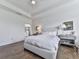 Bright main bedroom with a tray ceiling and hardwood floors at 603 Canyon Overlook, Canton, GA 30114