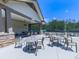 Gather with friends at this covered patio with tables and chairs and view of the tennis courts at 603 Canyon Overlook, Canton, GA 30114