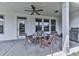 Covered outdoor patio featuring a ceiling fan, elegant wicker furniture, and a stainless steel gas grill at 603 Canyon Overlook, Canton, GA 30114