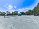 Tennis court featuring professional nets, lighting and lots of room for recreational activities at 603 Canyon Overlook, Canton, GA 30114