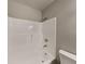 Clean, updated bathroom showcasing a white tub and shower combination with modern fixtures at 908 Kennesaw Dr, Forest Park, GA 30297