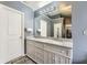 Bright bathroom features a double vanity, granite countertop, and modern fixtures at 2331 Flowerdale Ct, Douglasville, GA 30135