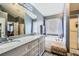 Serene bathroom with a double vanity, granite countertop, soaking tub, and shower at 2331 Flowerdale Ct, Douglasville, GA 30135