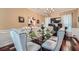 Elegant dining room featuring a glass table, chandelier, and decorative accents at 2331 Flowerdale Ct, Douglasville, GA 30135