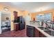 Bright kitchen featuring modern appliances and a view into the dining area at 2331 Flowerdale Ct, Douglasville, GA 30135