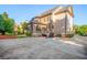 Exterior view of the back of a home with a spacious backyard and a two car parking pad at 2604 Heltonwood Ct, Buford, GA 30519