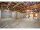 Unfinished basement with concrete walls and exposed ceiling, offering potential for personalization at 2604 Heltonwood Ct, Buford, GA 30519