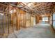 Unfinished basement showing exposed beams, framing, and concrete floor, ready for customization at 2604 Heltonwood Ct, Buford, GA 30519