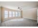 Spacious bedroom featuring a window seat and neutral carpeting at 2604 Heltonwood Ct, Buford, GA 30519