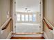 View of a bedroom with a window seat from the top of the stairs at 2604 Heltonwood Ct, Buford, GA 30519
