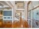 A grand foyer with hardwood floors, staircase, and views into the adjacent living spaces at 2604 Heltonwood Ct, Buford, GA 30519