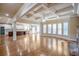 Bright and open living space featuring hardwood floors, stone fireplace, and seamless flow into the kitchen and breakfast nook at 2604 Heltonwood Ct, Buford, GA 30519