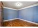 Office space with hardwood floors, single light, and entry to the main hall through lovely glass paned doors at 2604 Heltonwood Ct, Buford, GA 30519