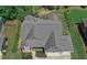 Aerial view of a home with a large roof, landscaping, and a driveway at 295 Hanover Dr, Villa Rica, GA 30180