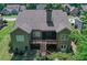 A spacious backyard with lush greenery, a screened porch and a patio area at 295 Hanover Dr, Villa Rica, GA 30180