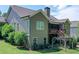 A spacious backyard with lush greenery, a screened porch and a patio area at 295 Hanover Dr, Villa Rica, GA 30180