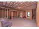 Unfinished basement awaiting customization with visible framing and utilities at 295 Hanover Dr, Villa Rica, GA 30180