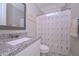 Bathroom featuring granite countertop vanity, with a shower-tub combo at 295 Hanover Dr, Villa Rica, GA 30180