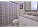Bathroom featuring granite countertop vanity, with a shower-tub combo at 295 Hanover Dr, Villa Rica, GA 30180