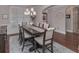 Bright dining room with a large window for natural light and a stylish rug under the table, enhancing the dining experience at 295 Hanover Dr, Villa Rica, GA 30180