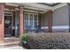 Inviting front porch with stone accents, rocking chairs, and a welcome sign at 295 Hanover Dr, Villa Rica, GA 30180