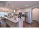 Well-lit kitchen boasts a granite island, stainless steel appliances, and a breakfast bar for casual dining and meal preparation at 295 Hanover Dr, Villa Rica, GA 30180