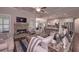 Spacious open-concept living area with a stone fireplace, connecting the kitchen and dining spaces for easy living at 295 Hanover Dr, Villa Rica, GA 30180