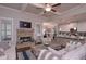 Comfortable living room with a stone fireplace and open access to the kitchen, ideal for relaxation and entertaining guests at 295 Hanover Dr, Villa Rica, GA 30180