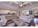 Bright and open living space features a coffered ceiling and seamless flow between kitchen, dining, and living areas at 295 Hanover Dr, Villa Rica, GA 30180