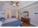 Comfortable main bedroom features a tray ceiling, ensuite bathroom, and a large dresser at 295 Hanover Dr, Villa Rica, GA 30180