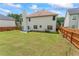 Spacious backyard with a well-maintained lawn and wooden fence that offers privacy for outdoor enjoyment at 507 Vaughan Dr, Hampton, GA 30228