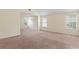 Spacious bedroom featuring three large windows and vaulted ceilings at 507 Vaughan Dr, Hampton, GA 30228