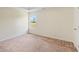 A cozy bedroom with wall to wall carpet and natural light from a window at 507 Vaughan Dr, Hampton, GA 30228