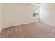 A bedroom with carpet and a window providing natural lighting at 507 Vaughan Dr, Hampton, GA 30228