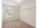 Walk in closet with carpet and built in shelving and natural light at 507 Vaughan Dr, Hampton, GA 30228