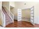 Open foyer with staircase, hardwood floors and modern doors leading to other rooms at 507 Vaughan Dr, Hampton, GA 30228