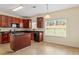 Kitchen with dark wood cabinetry and large windows that provide plenty of natural light at 507 Vaughan Dr, Hampton, GA 30228