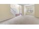 Spacious living room with staircase and modern doors leading to the foyer at 507 Vaughan Dr, Hampton, GA 30228