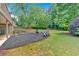 Large backyard with a fire pit, seating area, and plenty of space for outdoor activities at 1274 Cotton Gin Dr, Powder Springs, GA 30127