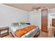This is a well-lit bedroom with a queen bed, wooden floors, and neutral-colored walls at 1274 Cotton Gin Dr, Powder Springs, GA 30127