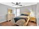 Cozy bedroom features a bed, dresser with mirror, and ample natural light at 1274 Cotton Gin Dr, Powder Springs, GA 30127